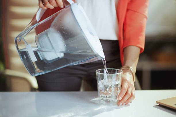 Closeup on modern business woman in modern green office stock photo