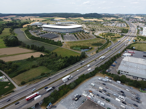 Aerial view overlooking the PreZero Arena football stadium, home of TSG 1899 Hoffenheim and a stretch of Autobahn 6, Sinsheim, Baden-Württemberg, Germany