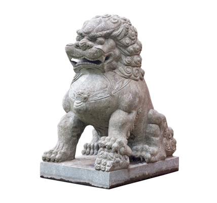 Chinese Temple Foo Dog Lion guard statue with Hong Kong harbor and red sail junk boat, China