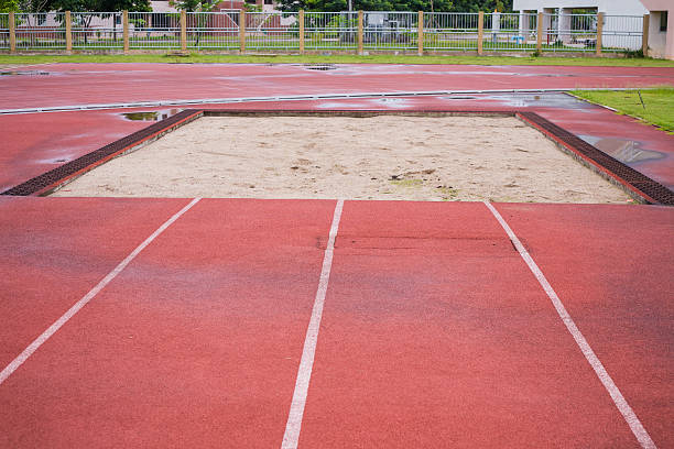 istock Curve of a Red jump Running Track 184717158