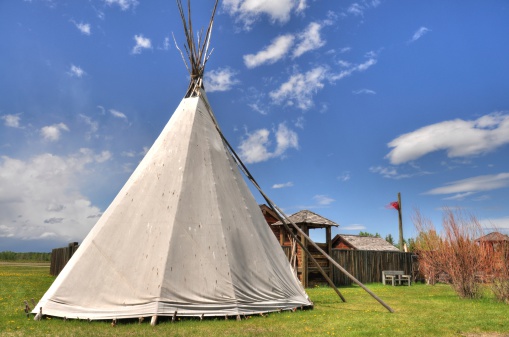 Teepee with blue sky in the prairies