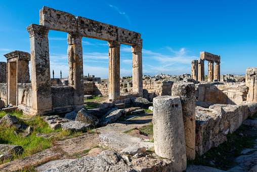 Hierapolis standing pillars and ruins of an ancient city. Pamukkale, Turkey