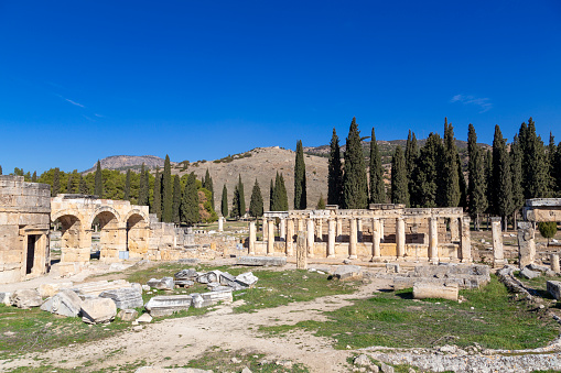 Hierapolis standing pillars and ruins of an ancient city. Pamukkale, Turkey