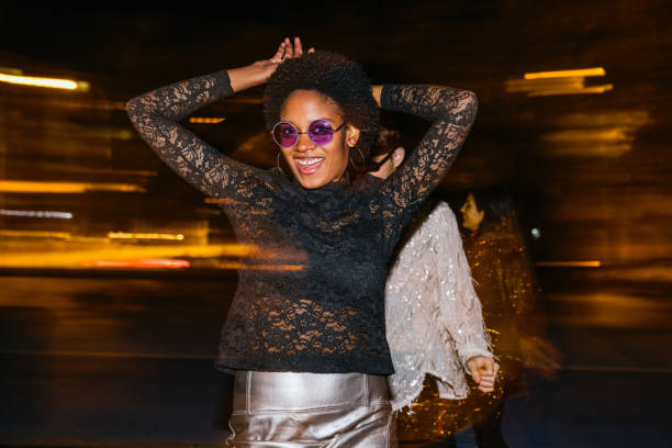 Joyful Dance Celebration at Night with Diverse Friends