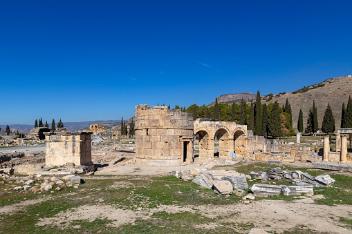 Hierapolis standing pillars and ruins of an ancient city. Pamukkale, Turkey