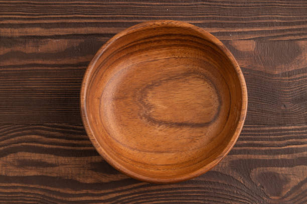 istock Empty brown wooden bowl on brown wooden. Top view, copy space 1847193887