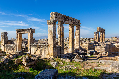 Hierapolis standing pillars and ruins of an ancient city. Pamukkale, Turkey