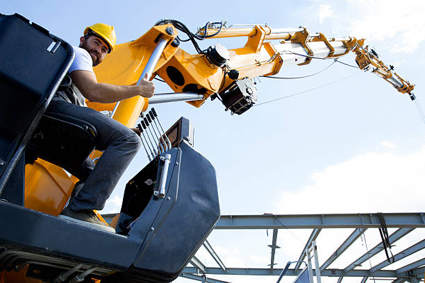 lean business plan construction example images Construction Worker Construction worker sitting on the crane seat and giving the ok sign. lean construction management stock pictures, royalty-free photos & images