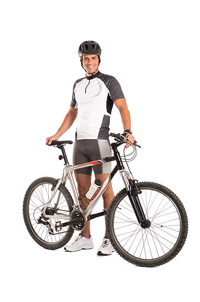 Young Male Cyclist Portrait Of A Young Male Cyclist Isolated On White Background. cycling vest photos stock pictures, royalty-free photos & images