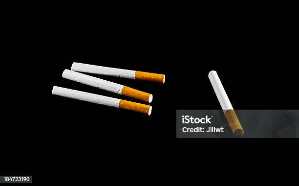 Four Cigarette Stock Photo - Download Image Now - Abstract, Addiction, Black Color