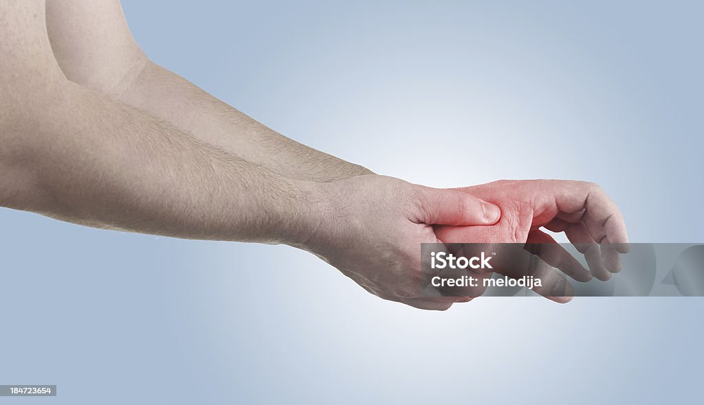 Pain in a man opisthenar palm area Pain in a man  opisthenar palm area. Male holding hand to spot of  opisthenar palm-ache. Adult Stock Photo