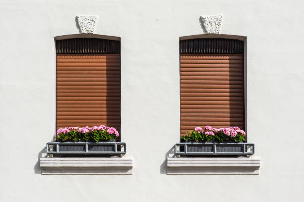 istock House with windows and colorful flowers 1847238689