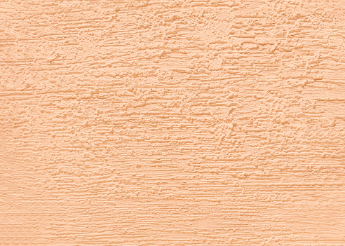 Wall texture with decorative peach plaster.