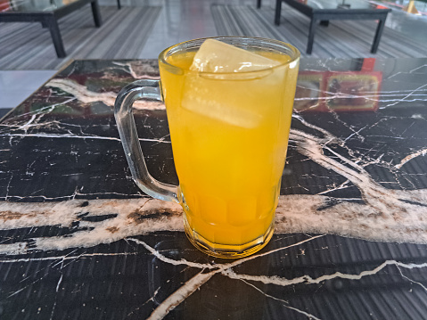 Serving Of Fresh Orange Iced In A Glass. Segelas Minuman Es Jeruk Segar. Drink Menu