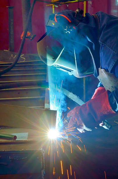 istock welder with protective mask welding metal 184730443