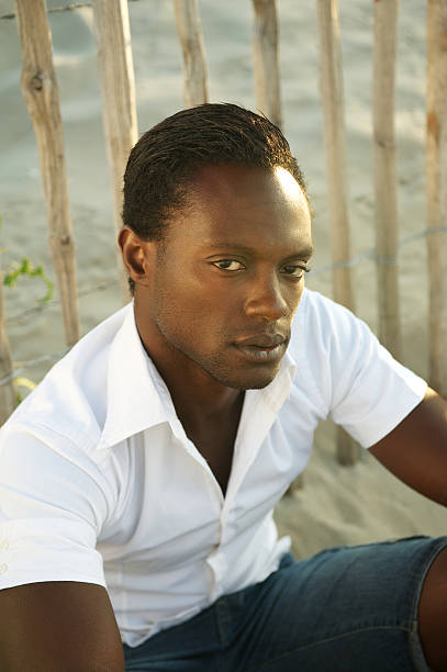 istock Handsome black man sitting and relaxing alone 184730592