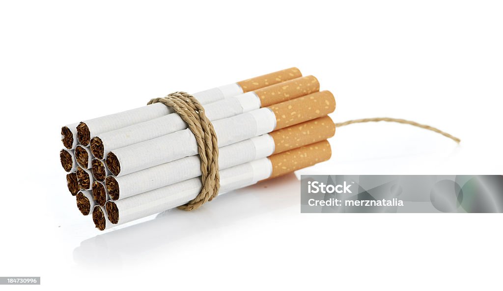 Cigarettes tied with rope and wick isolated on white Addiction Stock Photo