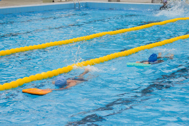 istock Two people swimming in a pool in a competition. 1847329577