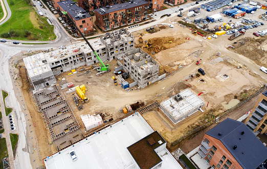 Drone point of view of construction of apartments. Concrete elements forming a house