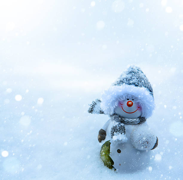 istock Christmas snowman and blue snow background 184734524
