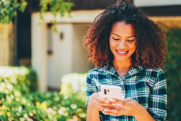 istock Woman texting at the street 1847345475