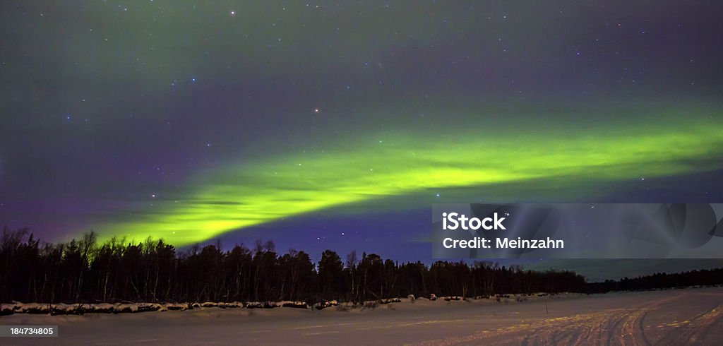 Northern Lights (Aurora boreal) over snowscape. - Foto de stock de Aire libre libre de derechos