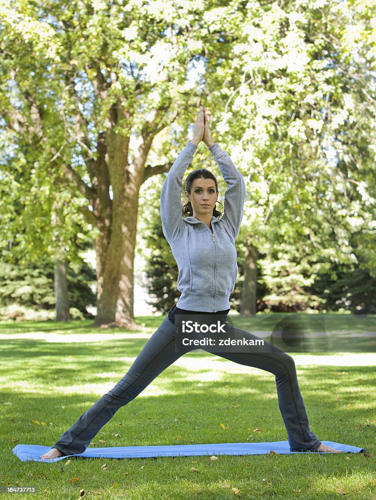yoga woman fitness model exercising yoga in the park during fall 20-29 Years Stock Photo