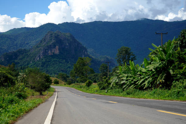 istock empty road  the road to the mountains scenery with blue sky background 1847390330