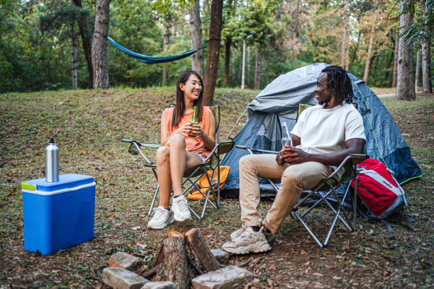 istock Friends enjoying while camping in the forest together 1847397194