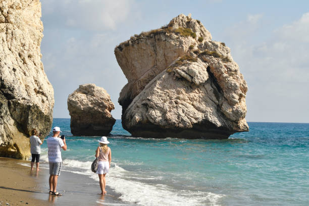 Episkopi, Cyprus - September 27, 2023: unidentified people on beach of Rock of Aphrodite according to legend, the birthplace of Aphrodite