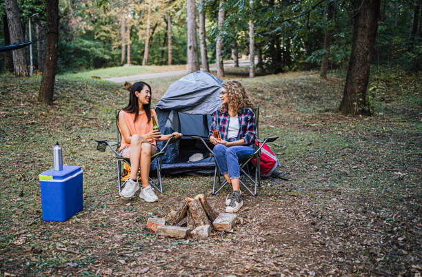 istock Female friends enjoy camping in nature 1847401167