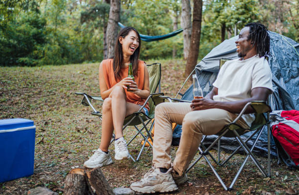 istock Friends enjoying while camping in the forest together 1847401338