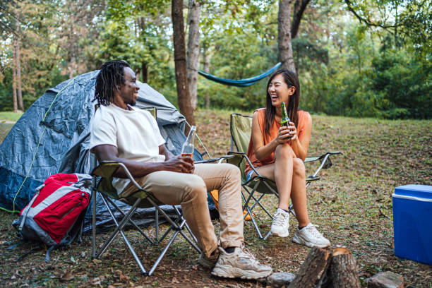 istock Friends enjoying while camping in the forest together 1847409636