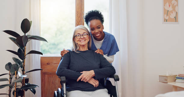 senior care, nurse and old woman with wheelchair, portrait and smile in health at nursing home. support, kindness and happy face of caregiver with elderly person with disability for homecare service. - ouderenzorg stockfoto's en -beelden