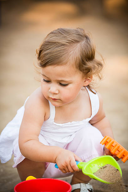 istock Toddler Playing in Sandbox 184741280
