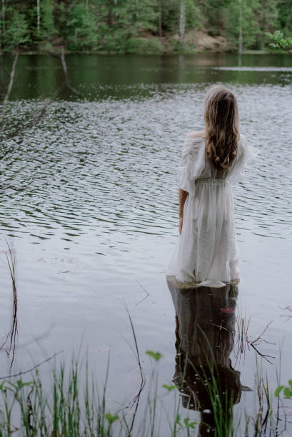 istock Woman Standing in Water 1847414984