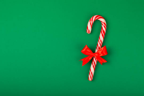 Christmas candy.Candy cane.Christmas composition with gifts, Christmas tree decorations on  background. Concept for Christmas and New Year holidays. Winter. Flatlay, top view, copy space.