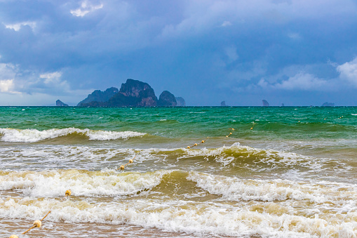Beautiful tropical paradise panorama view on turquoise water beach and between limestone rocks on Ao Nang Beach in Amphoe Mueang Krabi Thailand in Southeast Asia.