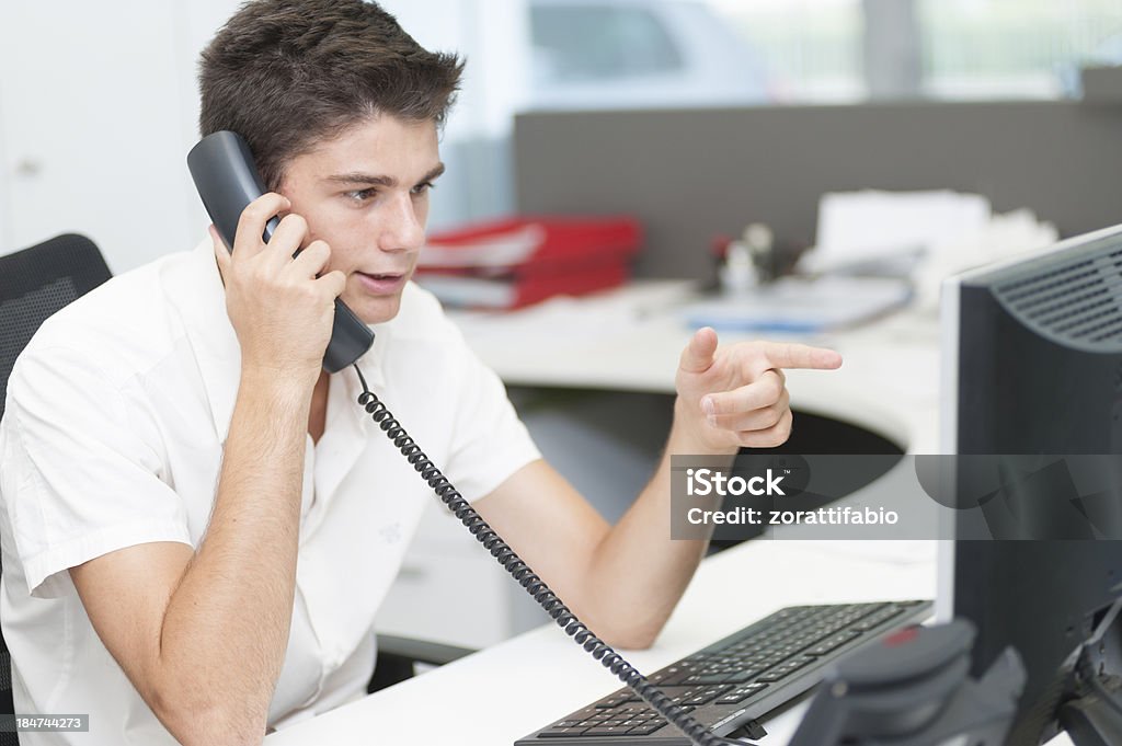 young man is calling Candid Stock Photo