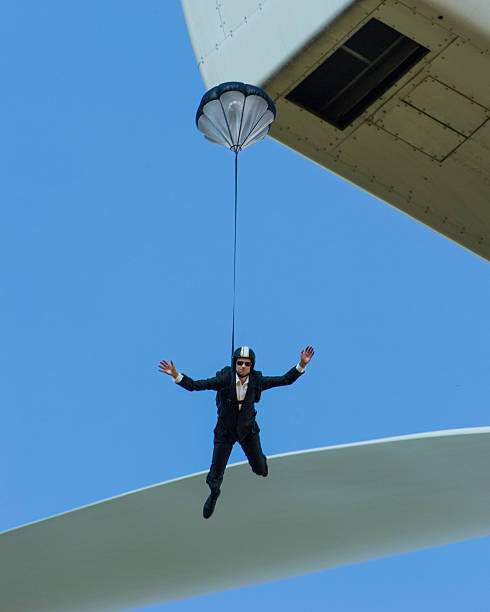 istock Suited BASE jumper falling from wind turbine 184745592