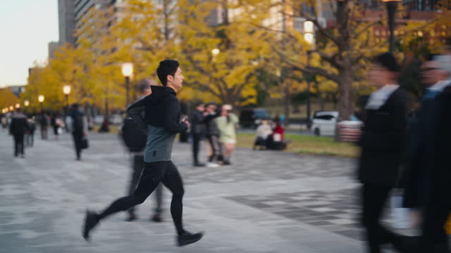 Male athlete running in city