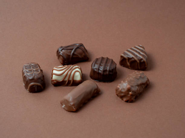 istock A varied assortment of chocolates arranged on a rich brown background. 1847466342