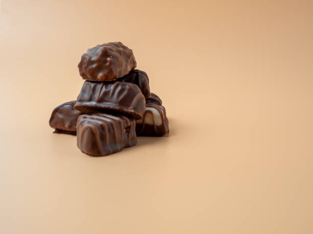 istock Chocolate candies on an orange background. 1847470038