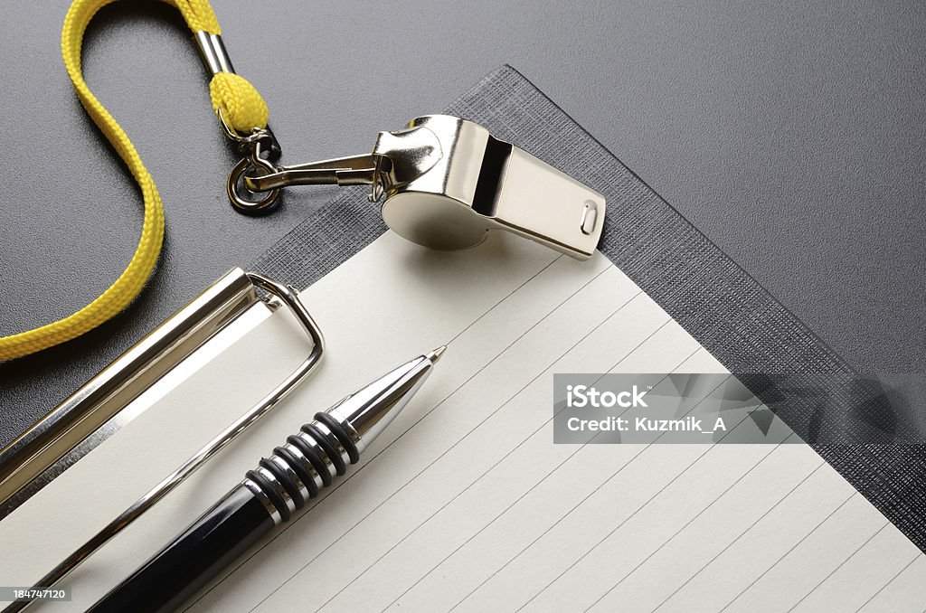 Whistle Metal sport whistle with pen and paper sheet Sport Stock Photo