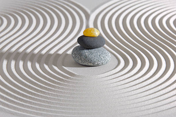 istock Japanese zen garden with swirls in the sand & pebble stack 184747473
