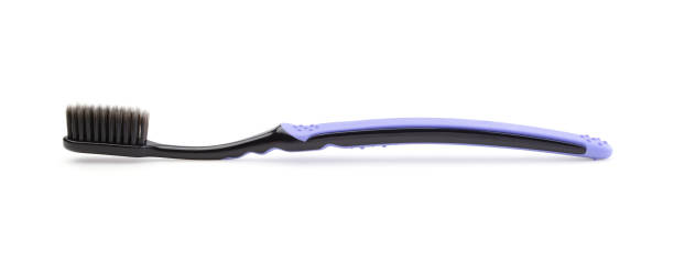 zahnbürste isoliert auf weiß. - dental hygiene elegance black toothbrush stock-fotos und bilder