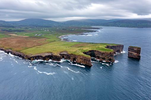 Aerial view of the stunning headland of Downpatrick Head along the Wild Atlantic Way near Ballycastle Village in County Mayo, Ireland.