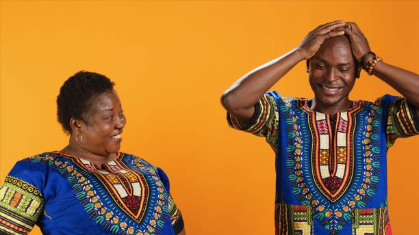 istock Joyful african american people laughing at something in studio 1847499674