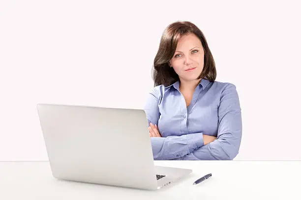 Photo of Business woman is sitting in front of laptop