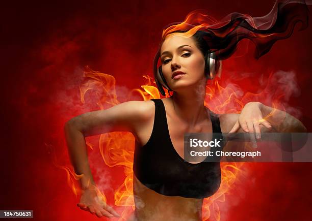 Girl With Headphones Stock Photo - Download Image Now - Fire - Natural Phenomenon, Listening, Music